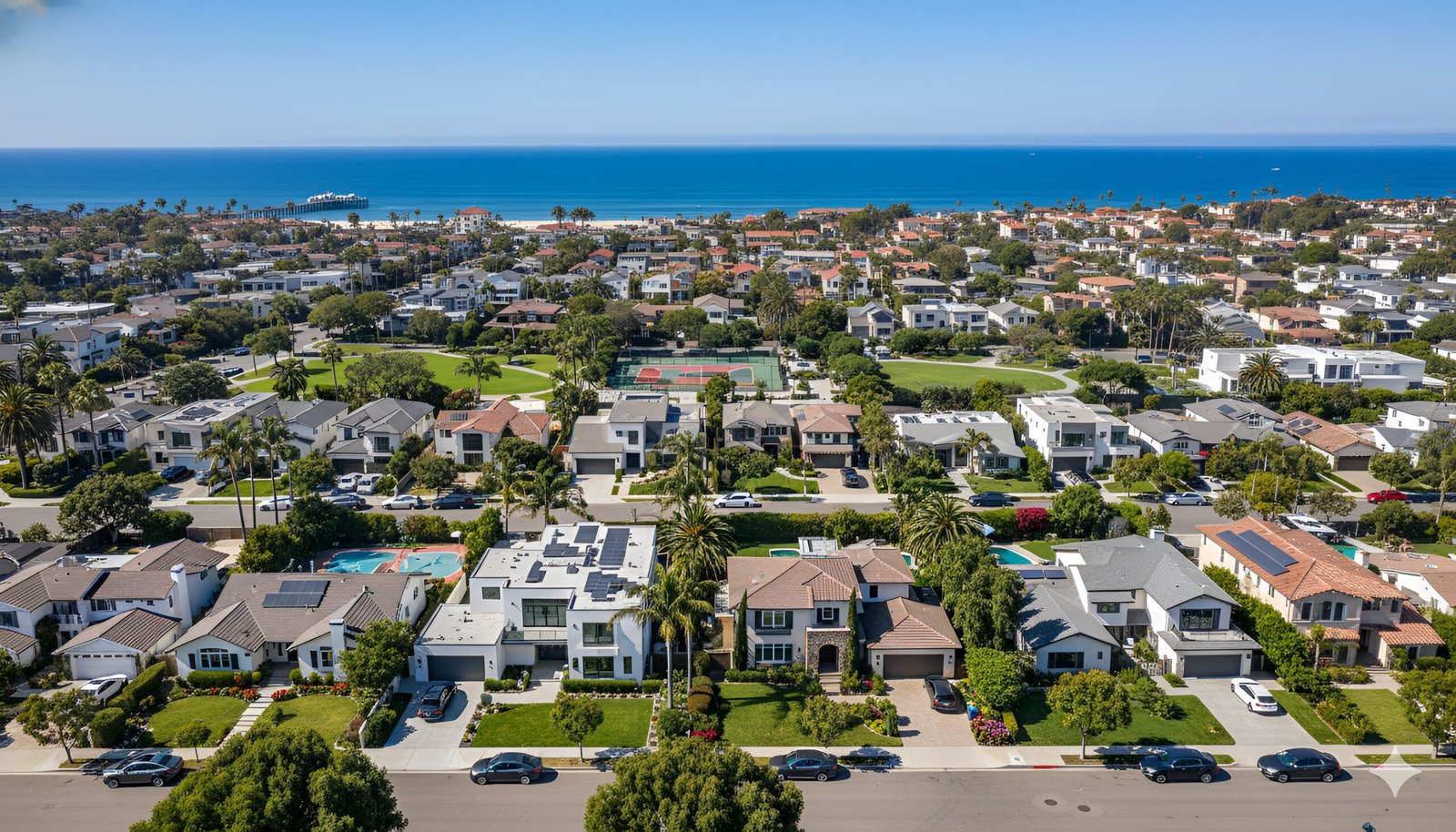 Aerial view of California real estate houses with streets and beaches in background